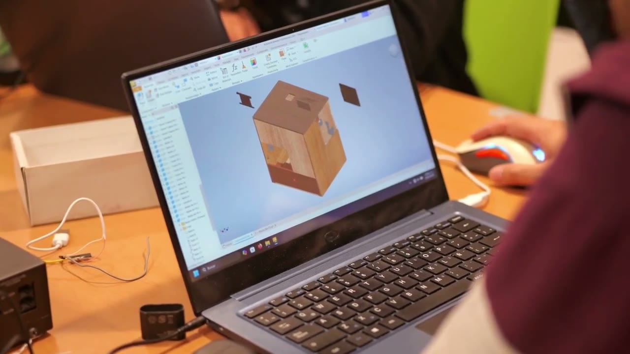 CAD on a laptop in the episode’s engineering-history montage.